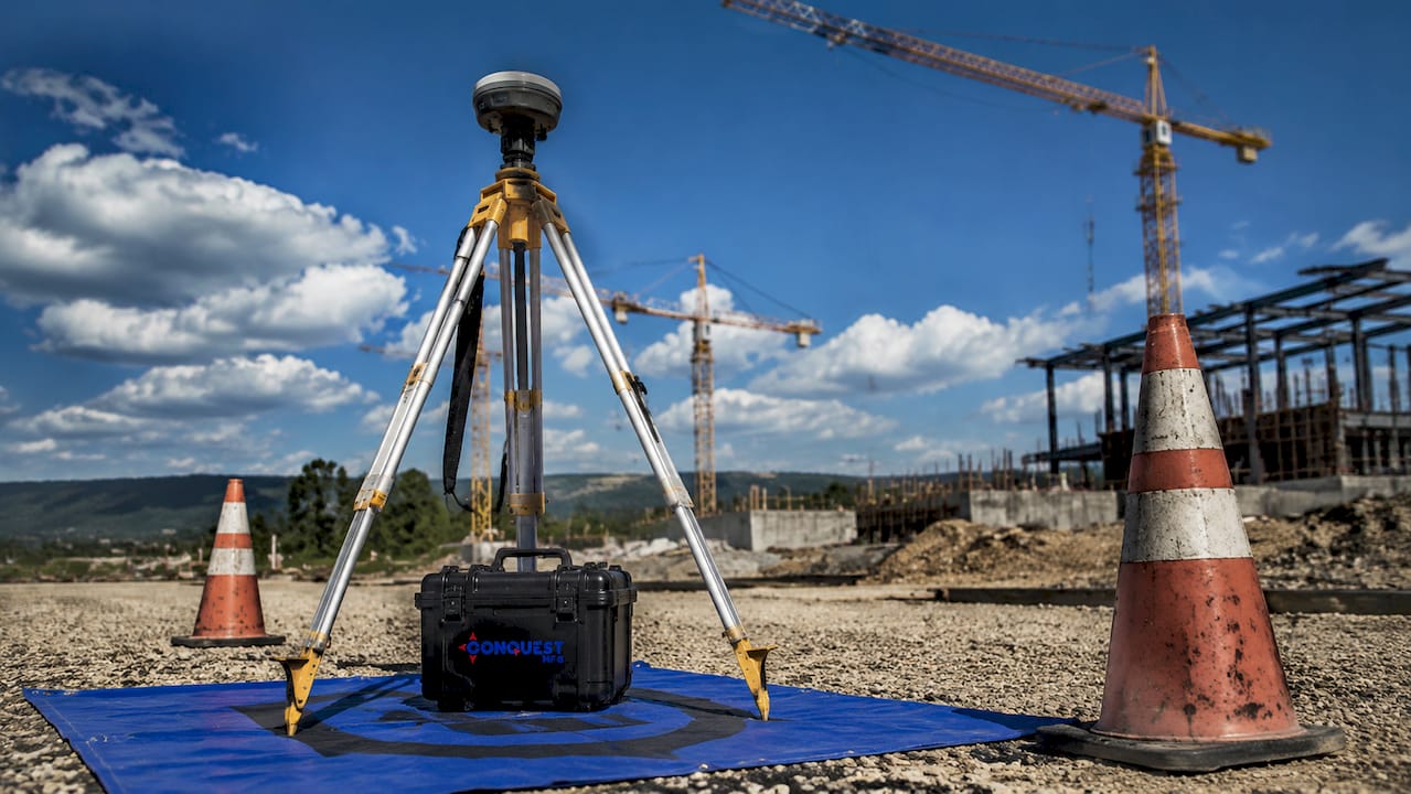 GNSS surveying setup at construction boundary