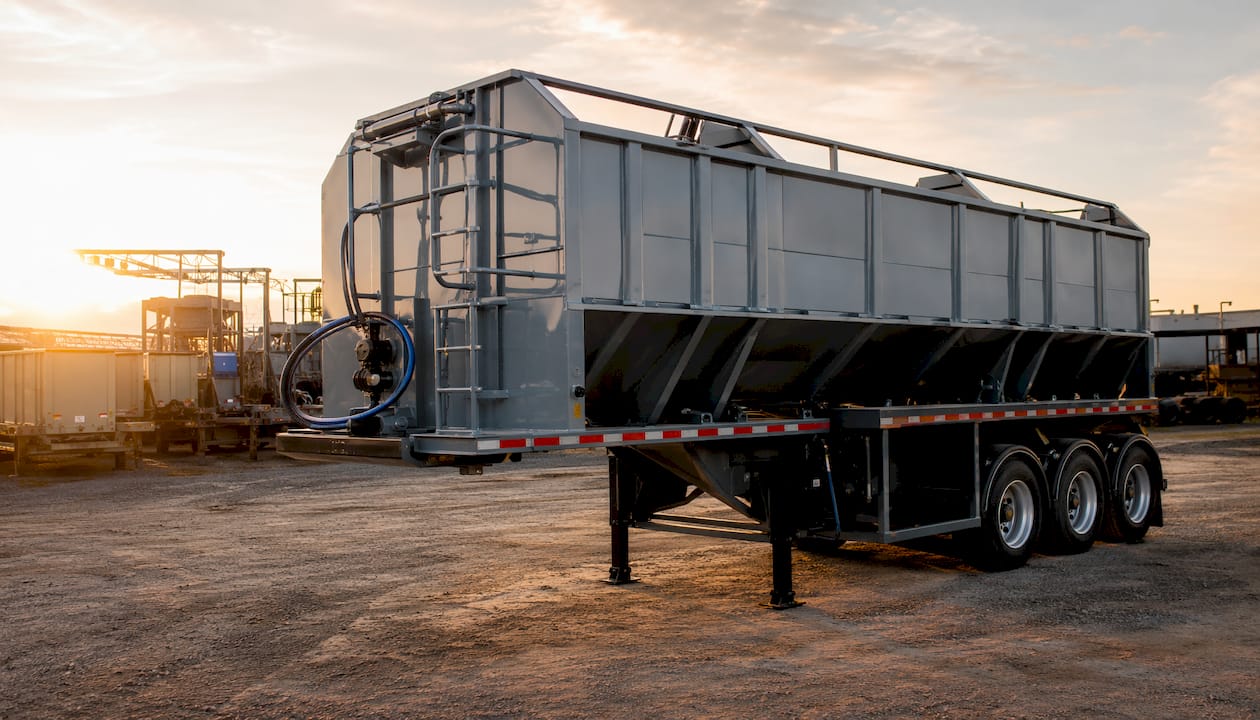 Side view of stationary storage pig trailer outdoors