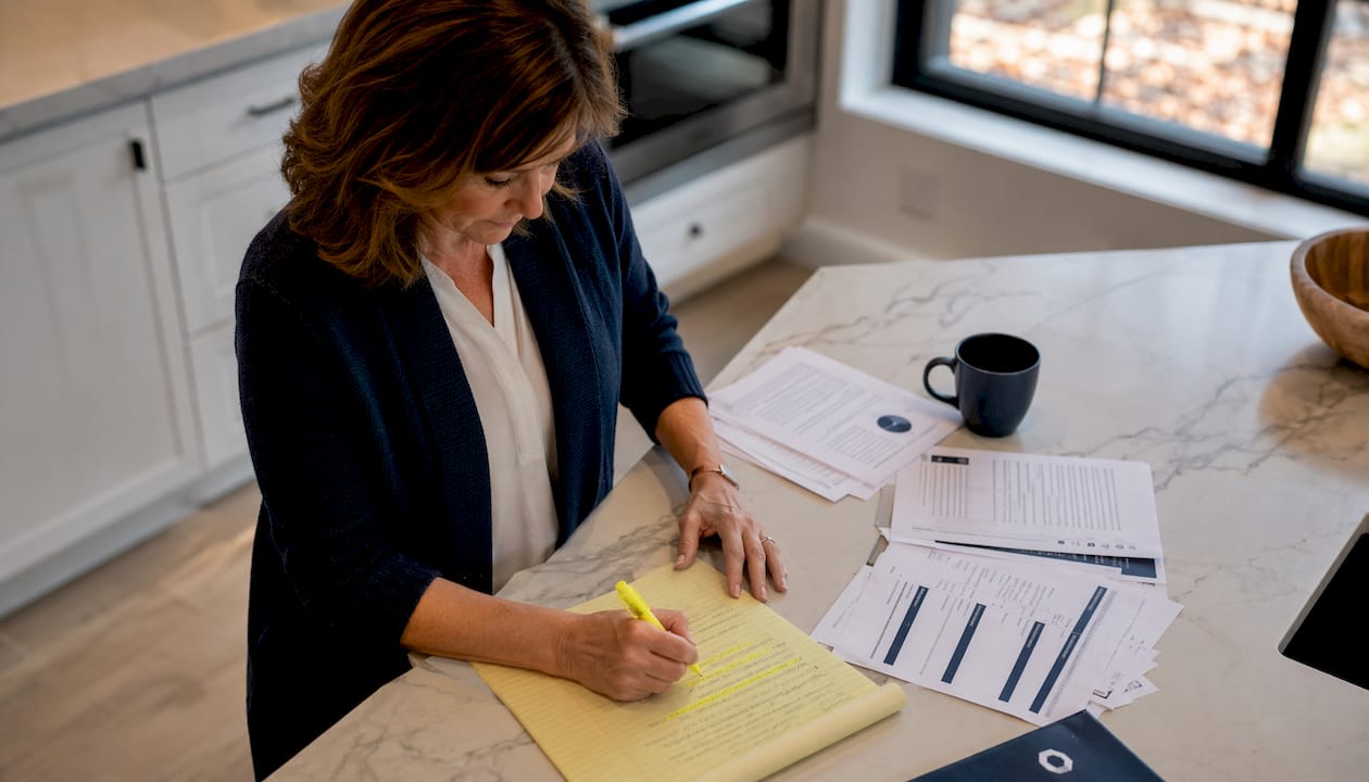 Woman reviewing addiction program documents