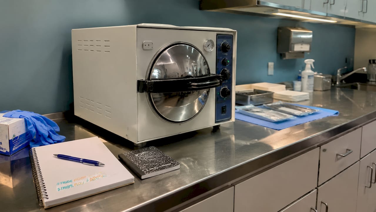 Podiatry autoclave sterilization setup with branding