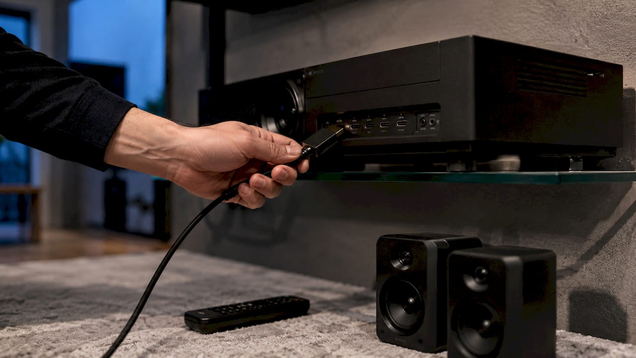 Close-up of HDMI ARC cable connection on projector