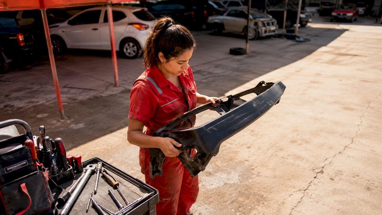 Auto Repair Checklist: Your Complete 2026 Guide 1 Technician Inspecting Removed Car Bumper