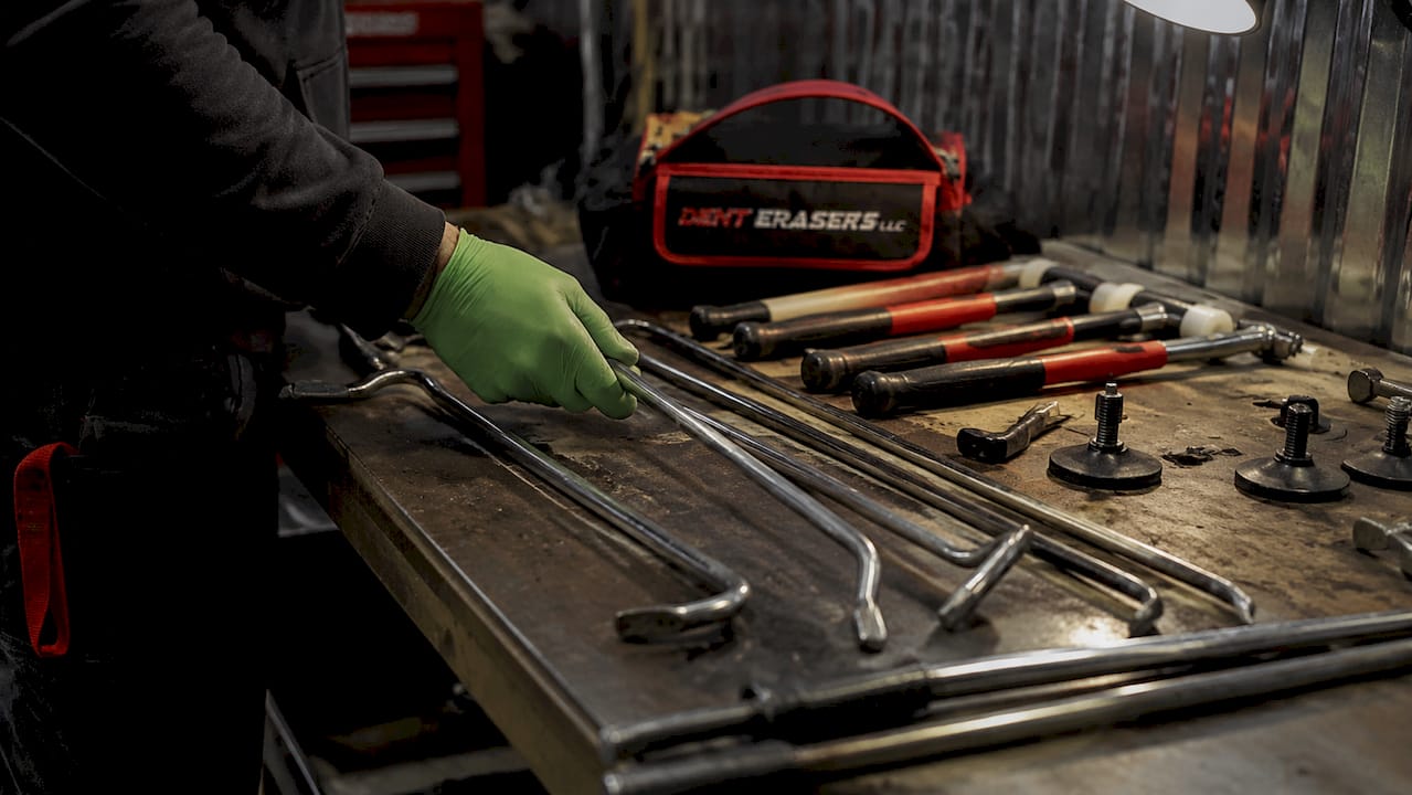 Car Door Repair Options: Your 2026 Decision Guide 1 Paintless Dent Repair Tools On Workbench With Hand