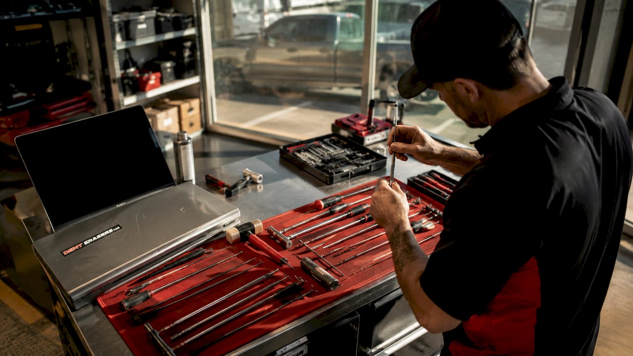 Why Use Certified Dent Technicians for Your Car 1 Close-Up Of Certified Dent Technician Tools On Workbench
