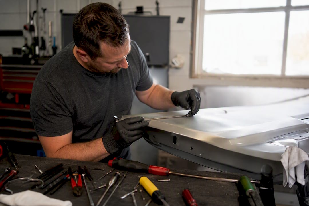 Roof Dent Repair PDR: What Works and When to Walk Away 2 Hands Isolating Steel Pdr Tool From Aluminum Panel