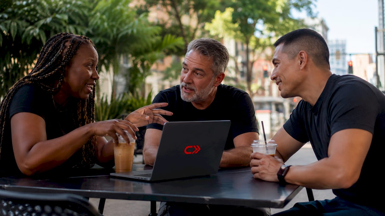 Group discussing car forum topics over coffee