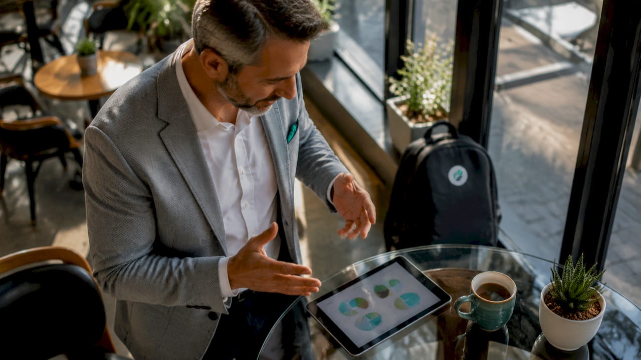 Manager reviewing documents to advocate employee promotion