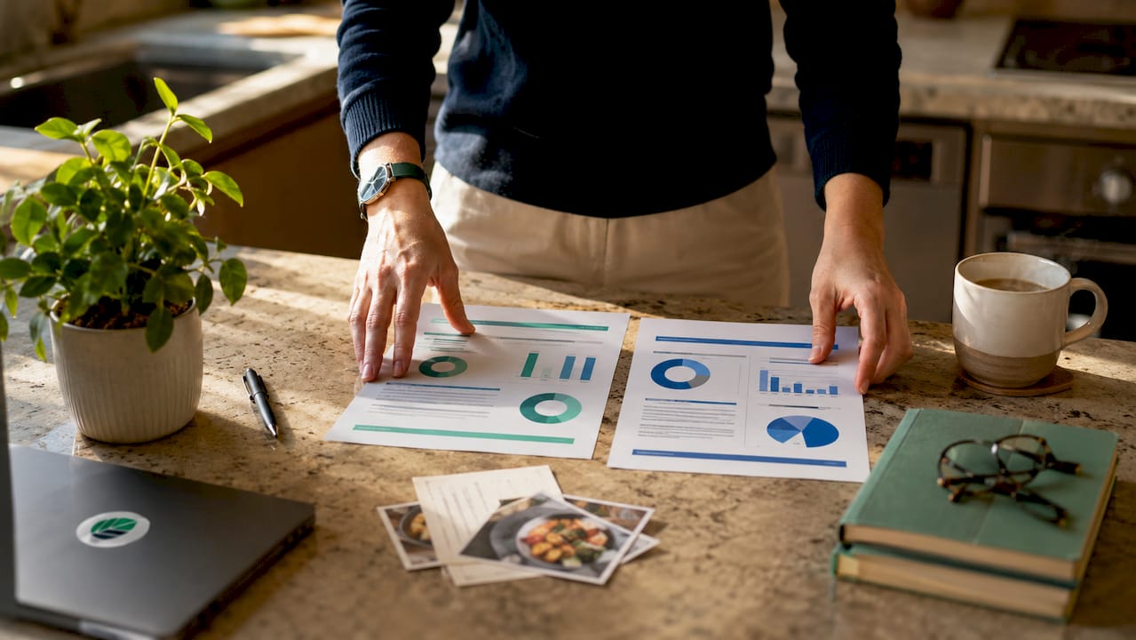 Hands comparing developmental and evaluative feedback documents