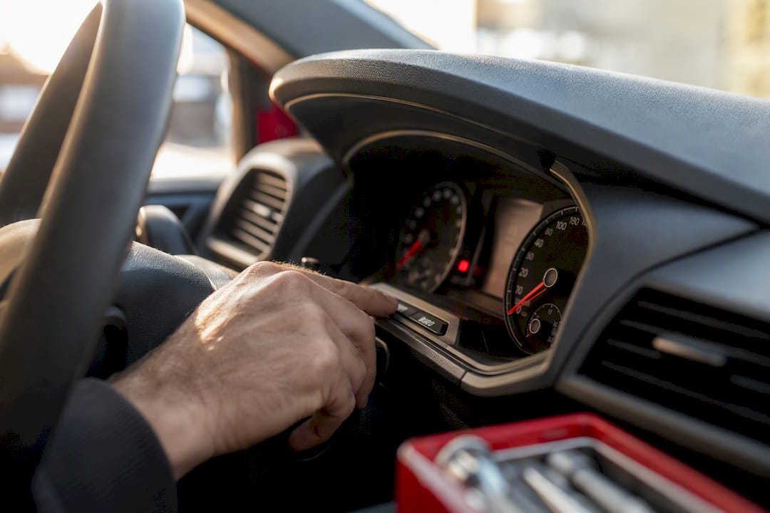 Hand adjusting car dashboard settings