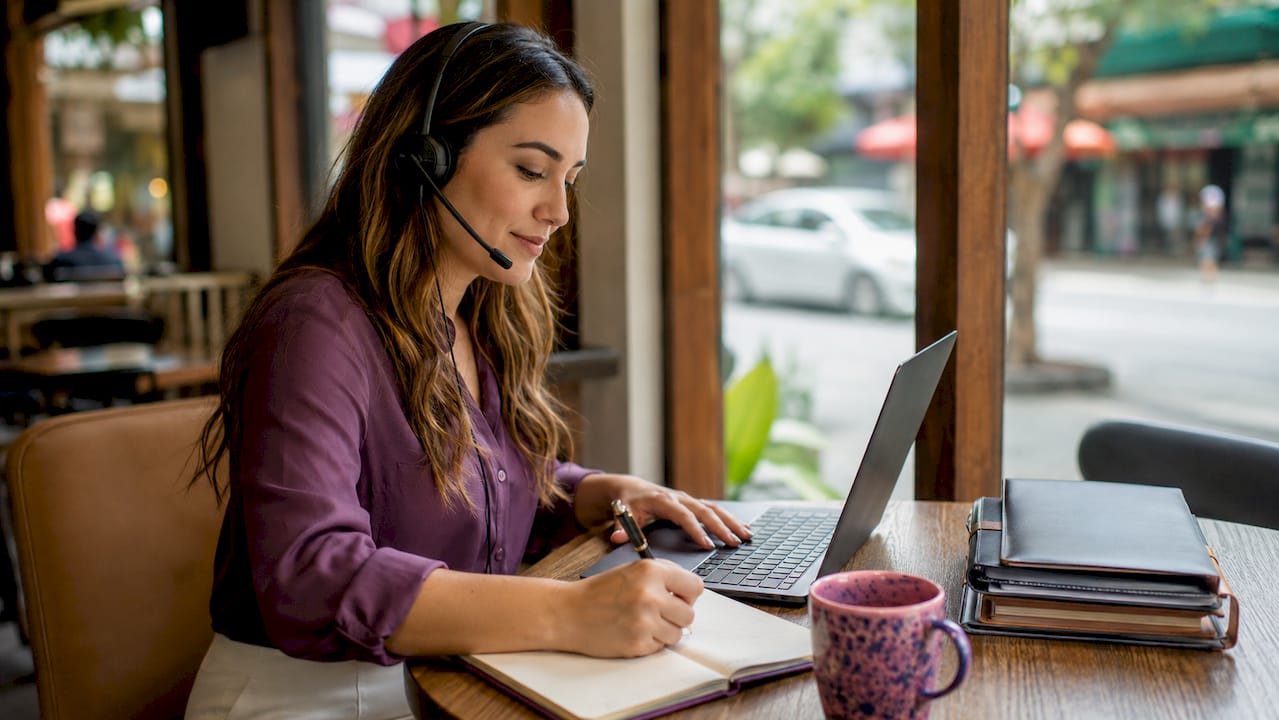 Remote virtual customer support agent at desk
