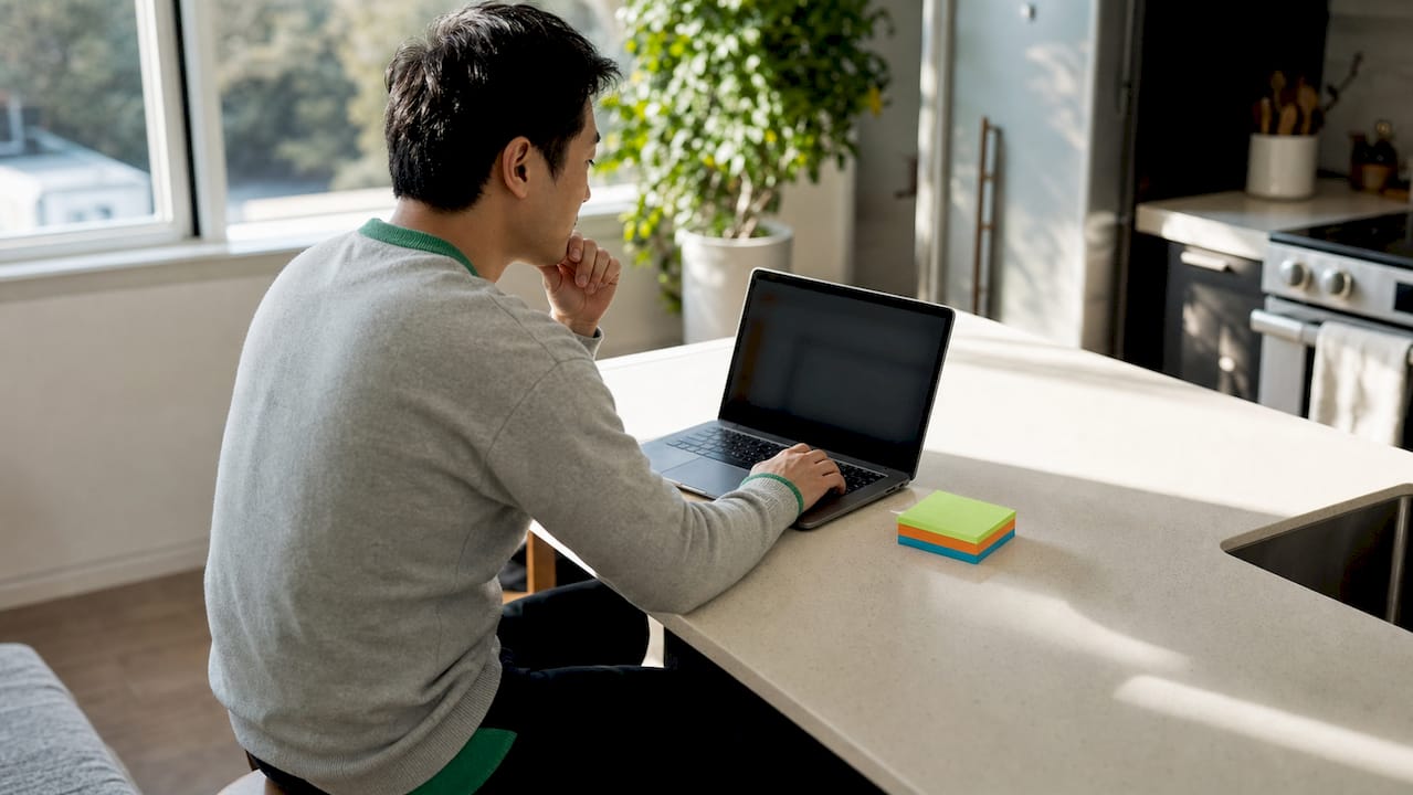 Person viewing PSLF payment count on laptop screen