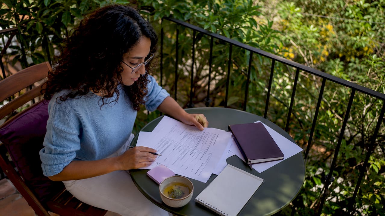 Woman reviewing virtual assistant hiring documents