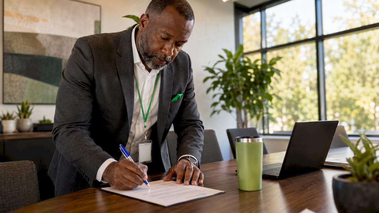 HR officer signing PSLF employment certification form