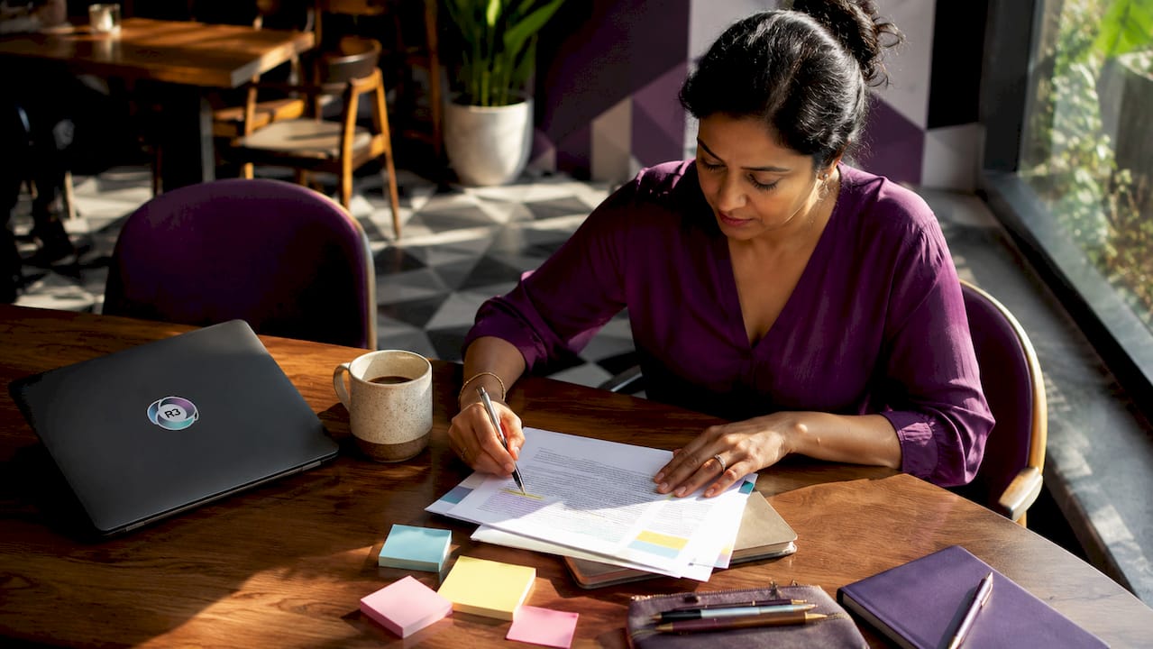 Manager organizing remote assistant tasks at home desk