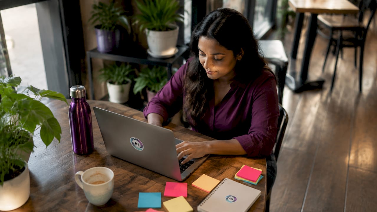 Solopreneur working with laptop in home office