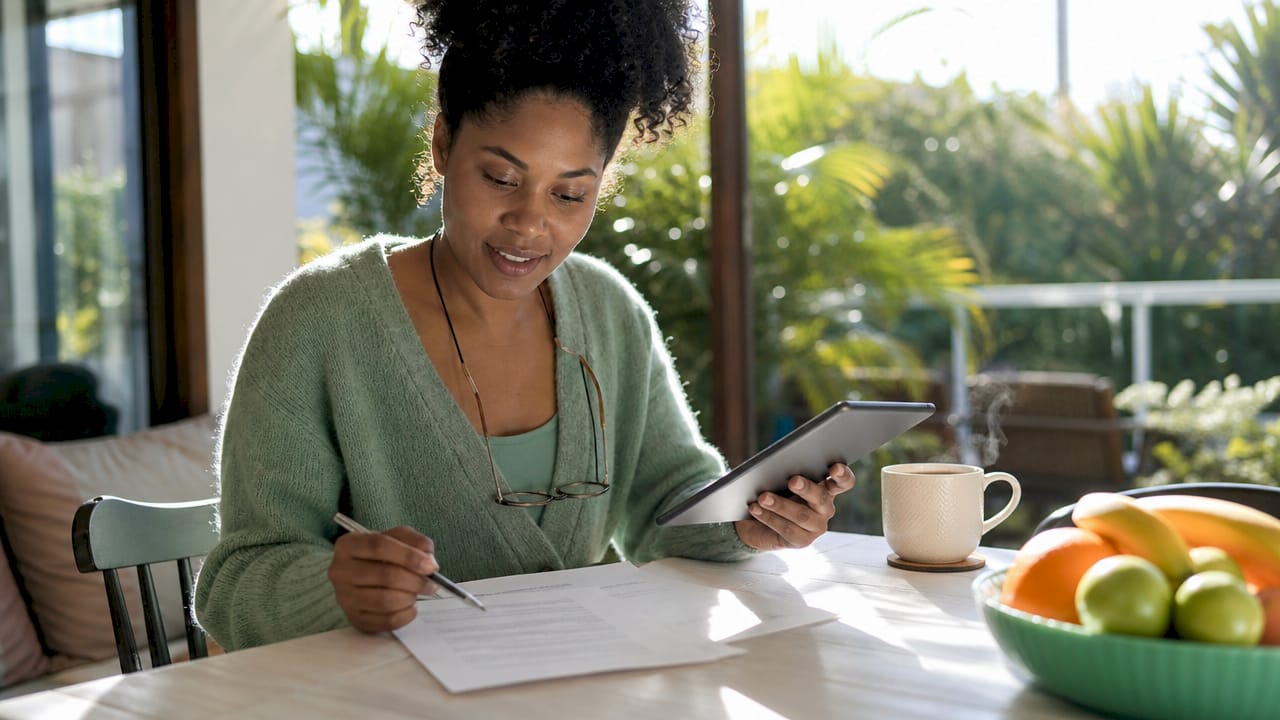 Woman reviewing student loan discharge papers