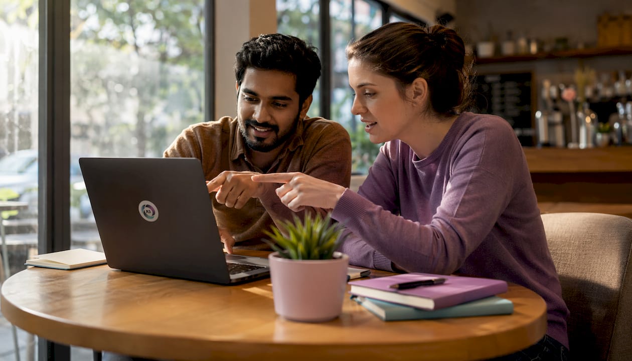Two professionals collaborating in coworking space