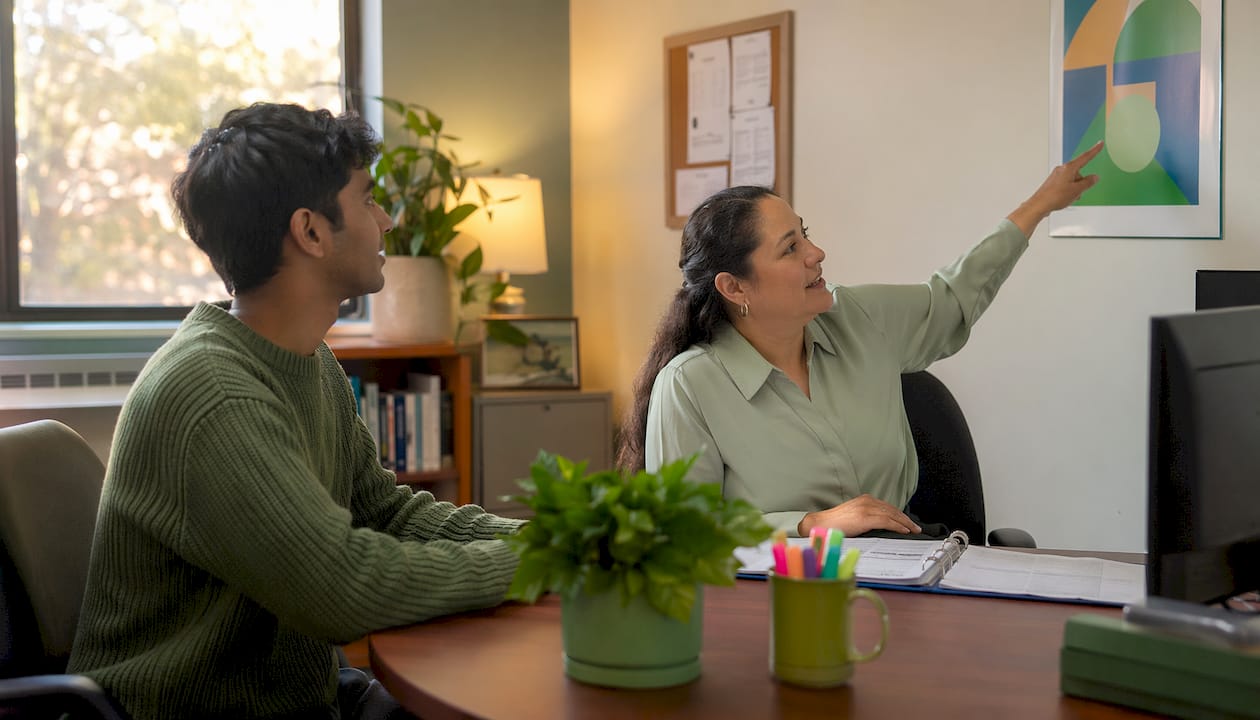 Student consulting with financial aid advisor on campus