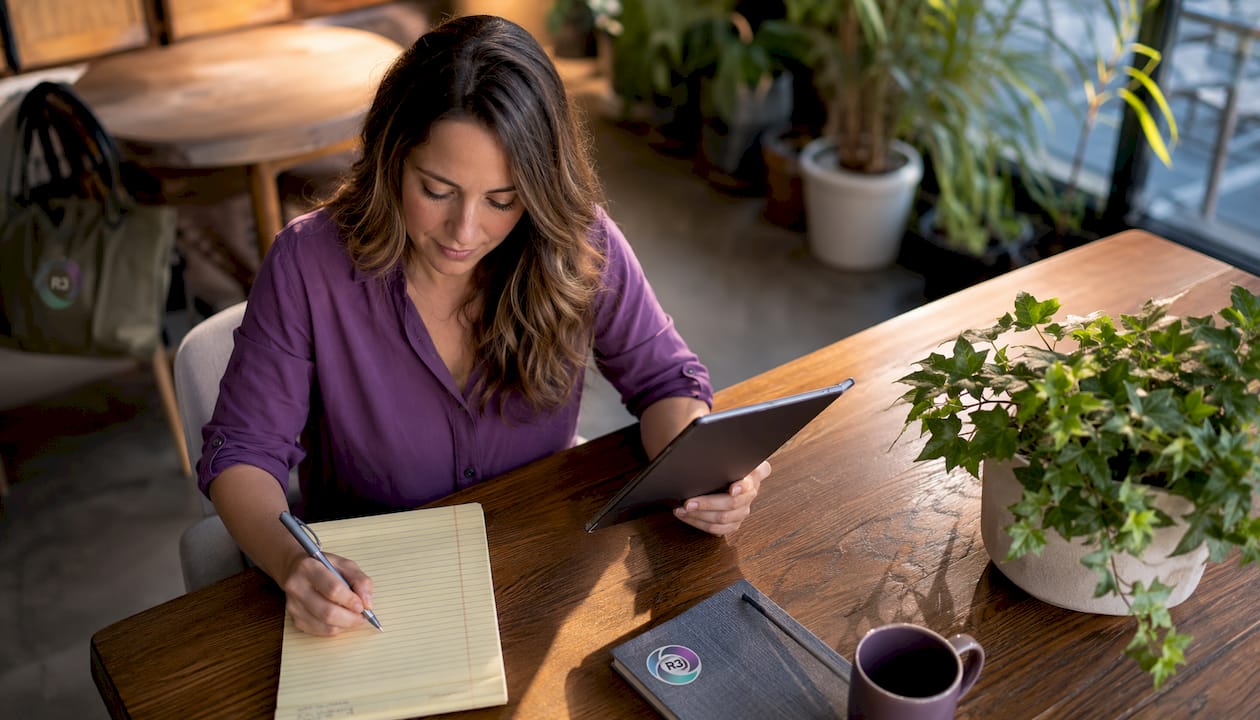 Recruiter reviewing resumes at home desk
