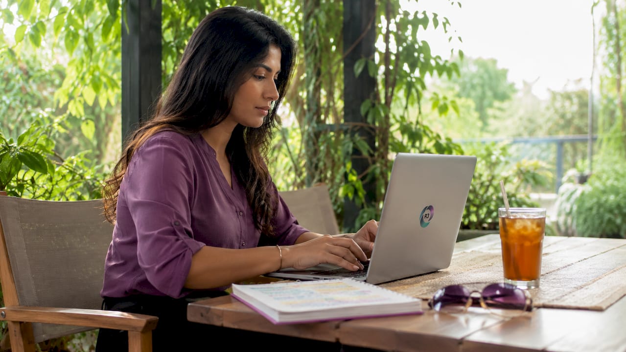 Side view of woman working as virtual assistant at home office