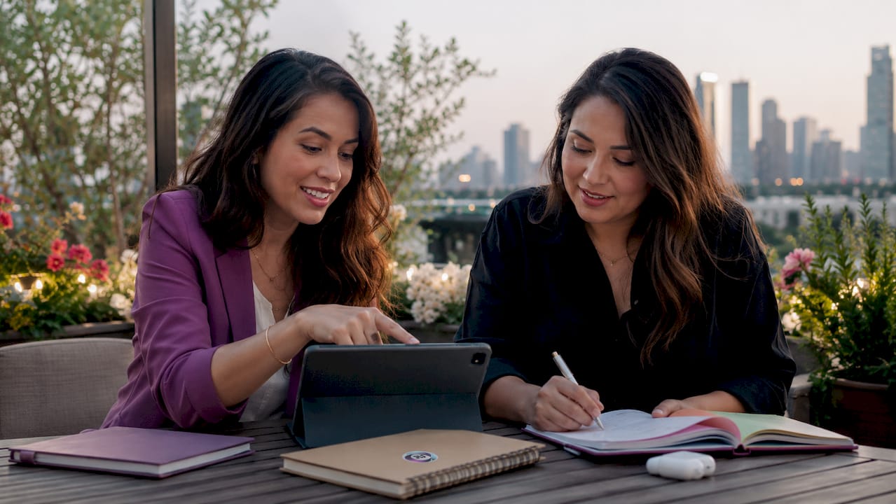 Two women collaborating in coworking space