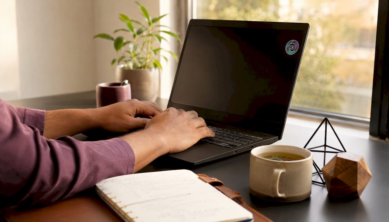 Hands typing laptop recording virtual assistant tasks