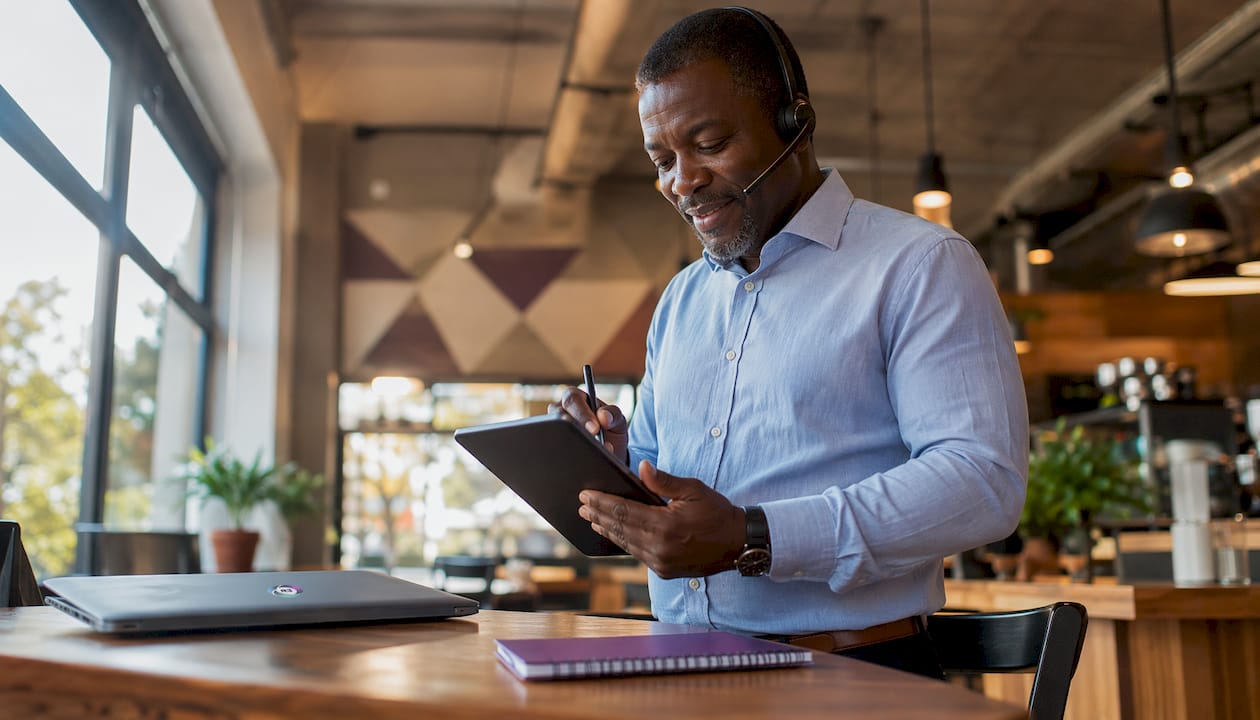 Entrepreneur in video call with virtual assistant