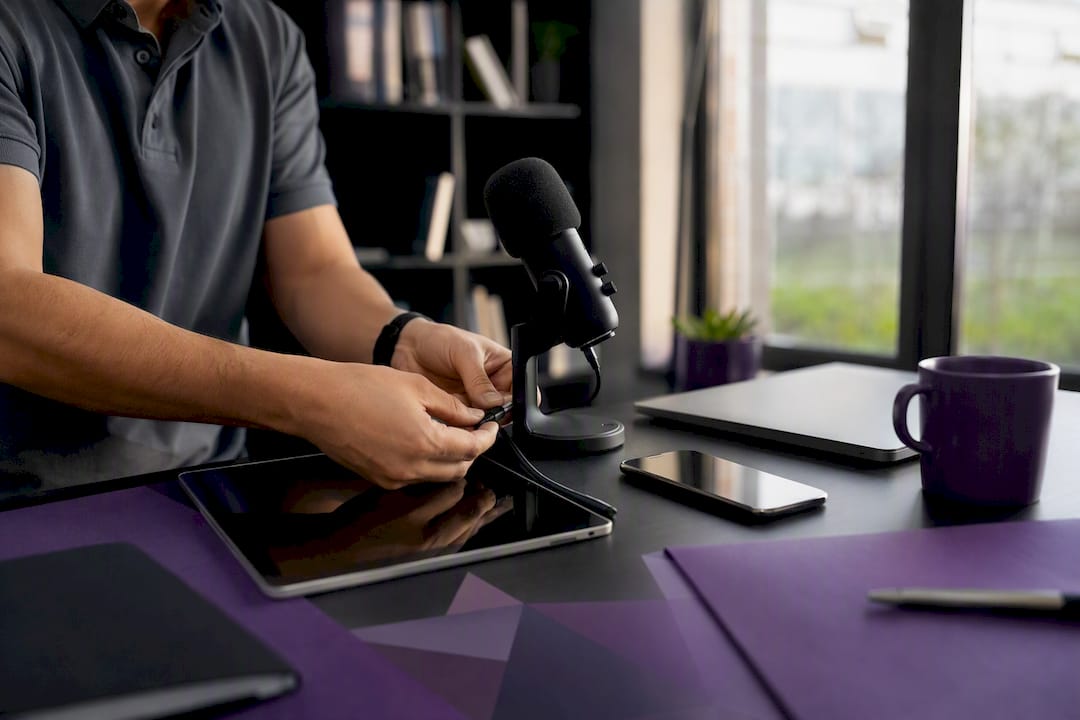 Hands connecting headset in modern home office