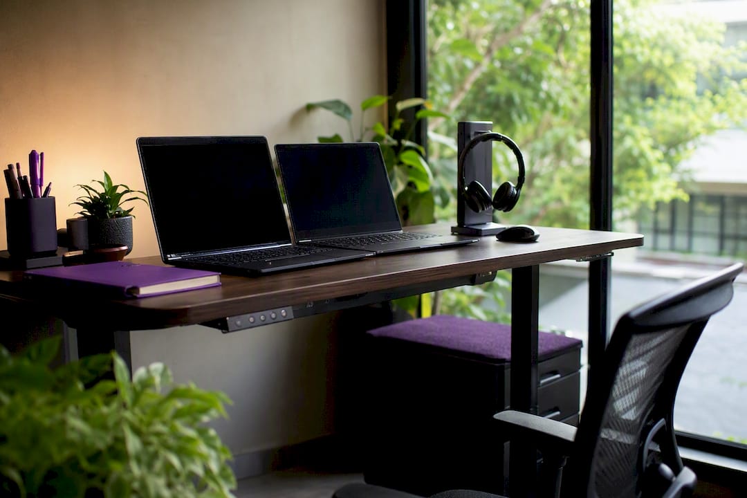 Modern Philippine office workspace with headset and laptops