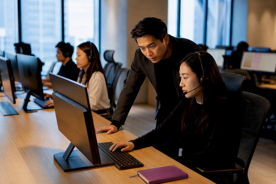 Customer support team handling outsourced service requests