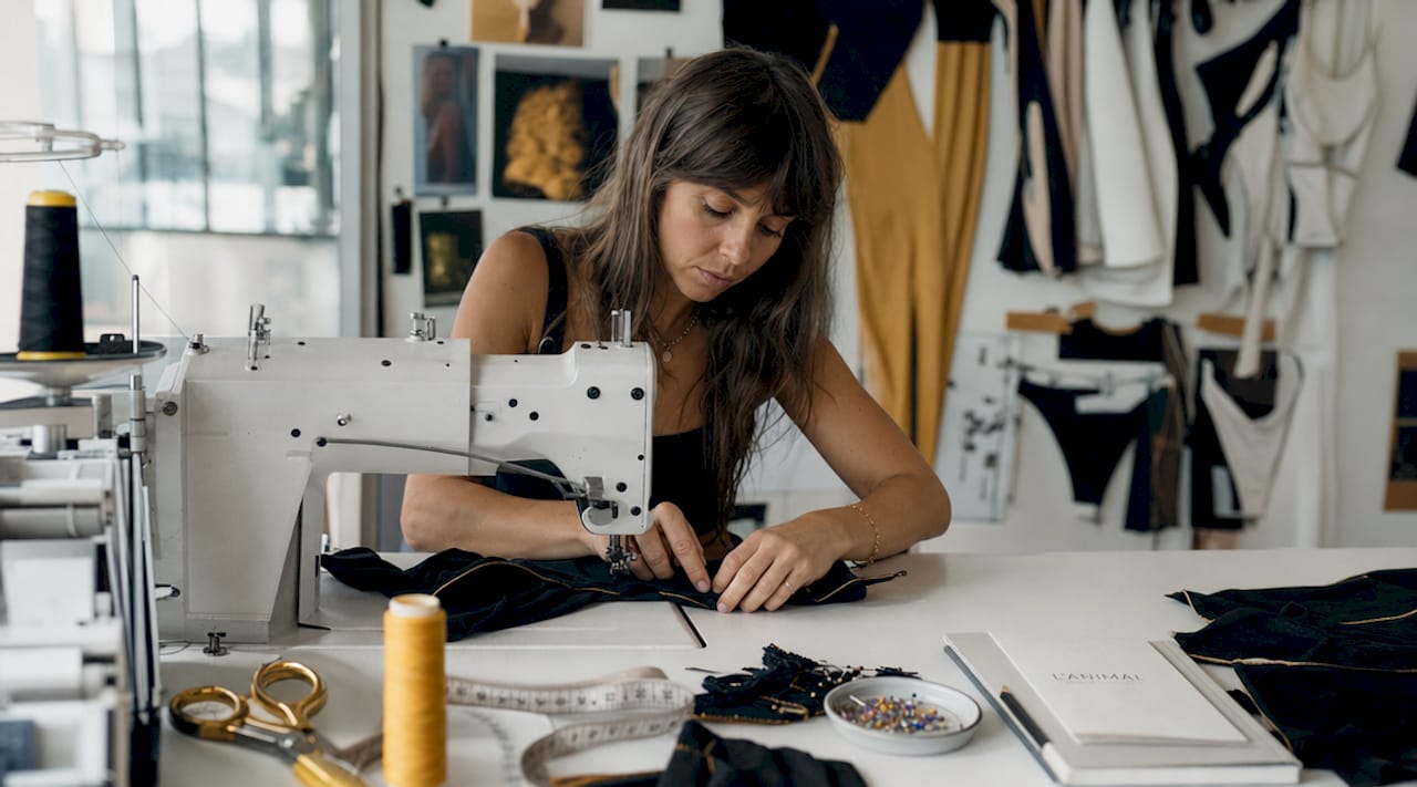 Seamstress sewing quality swimwear fabric