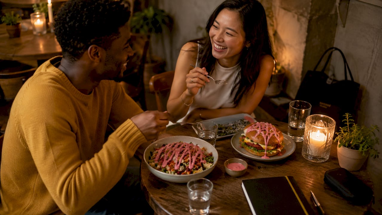 Couple enjoying food with island-style dressing outdoors
