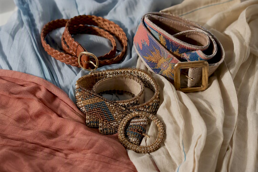 Three distinct belts styled with kaftan fabrics
