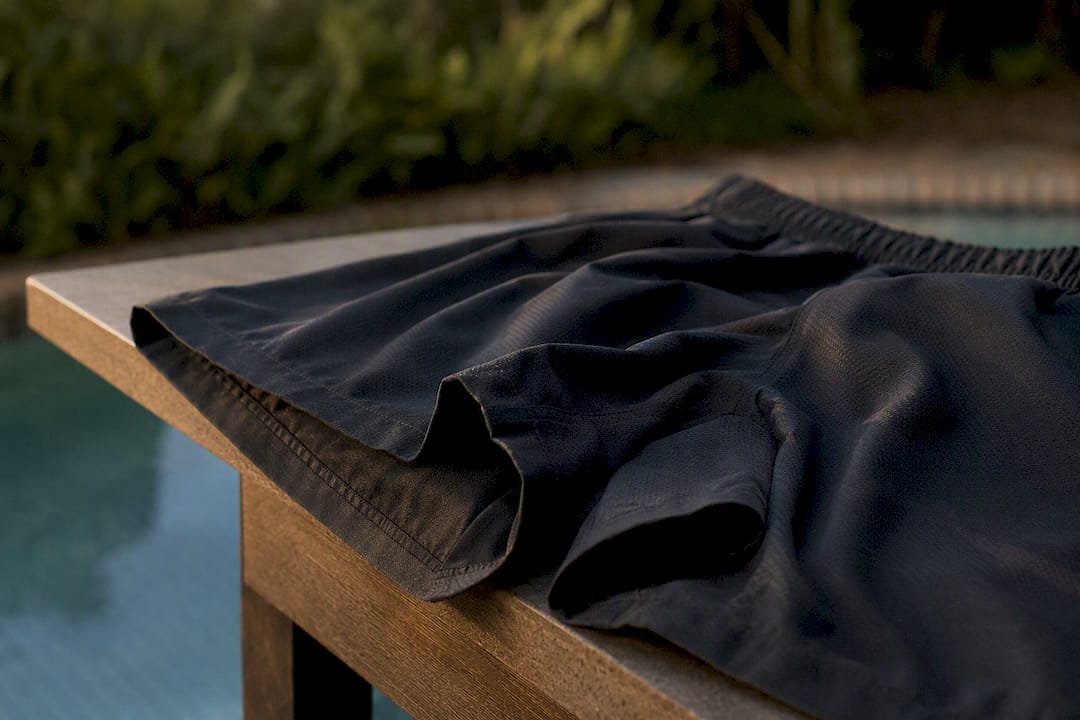 Boxer-style swim trunk fabric and leg opening