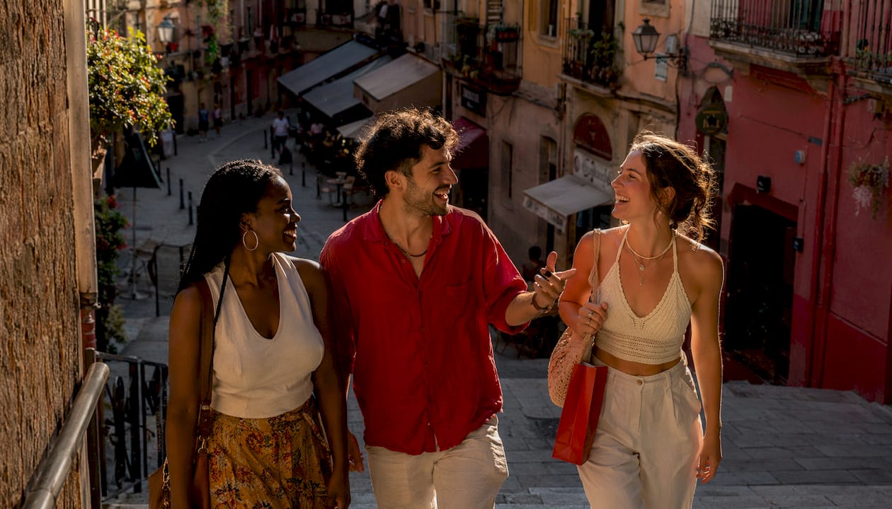 Friends walking and exploring Las Ramblas street