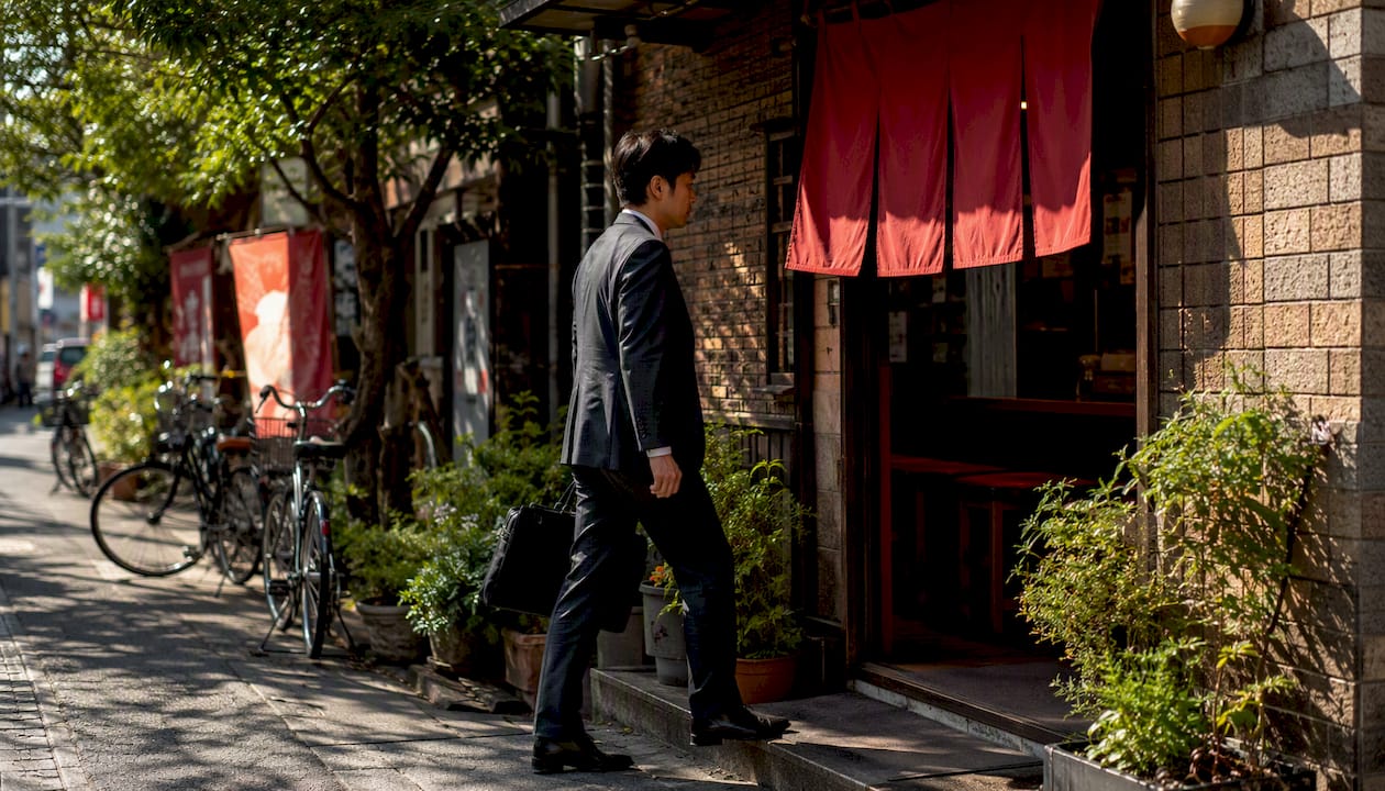 Salaryman walking to a local lunch spot in Tokyo