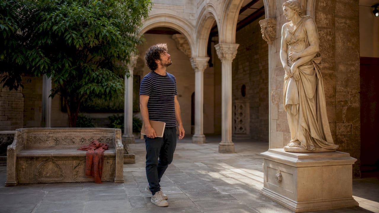 Traveler slowly viewing museum artwork