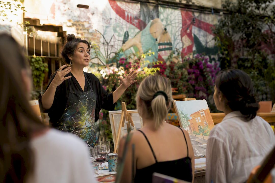 Attendees painting at a Barcelona workshop