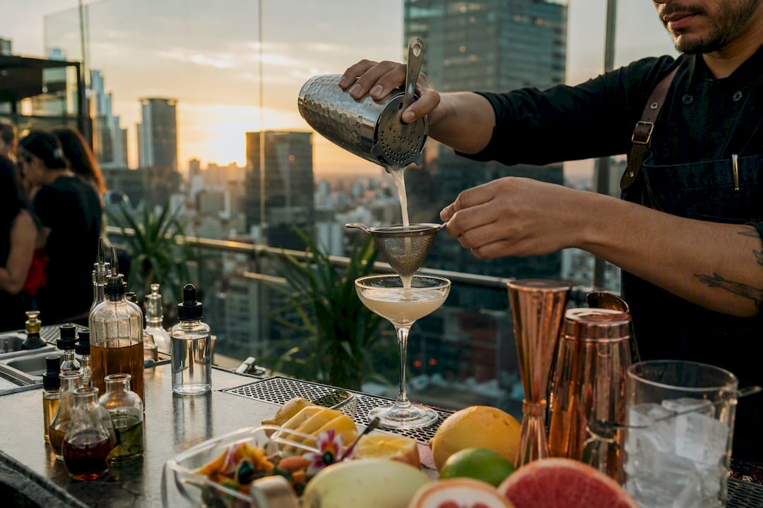 Bartender pouring personalized cocktail