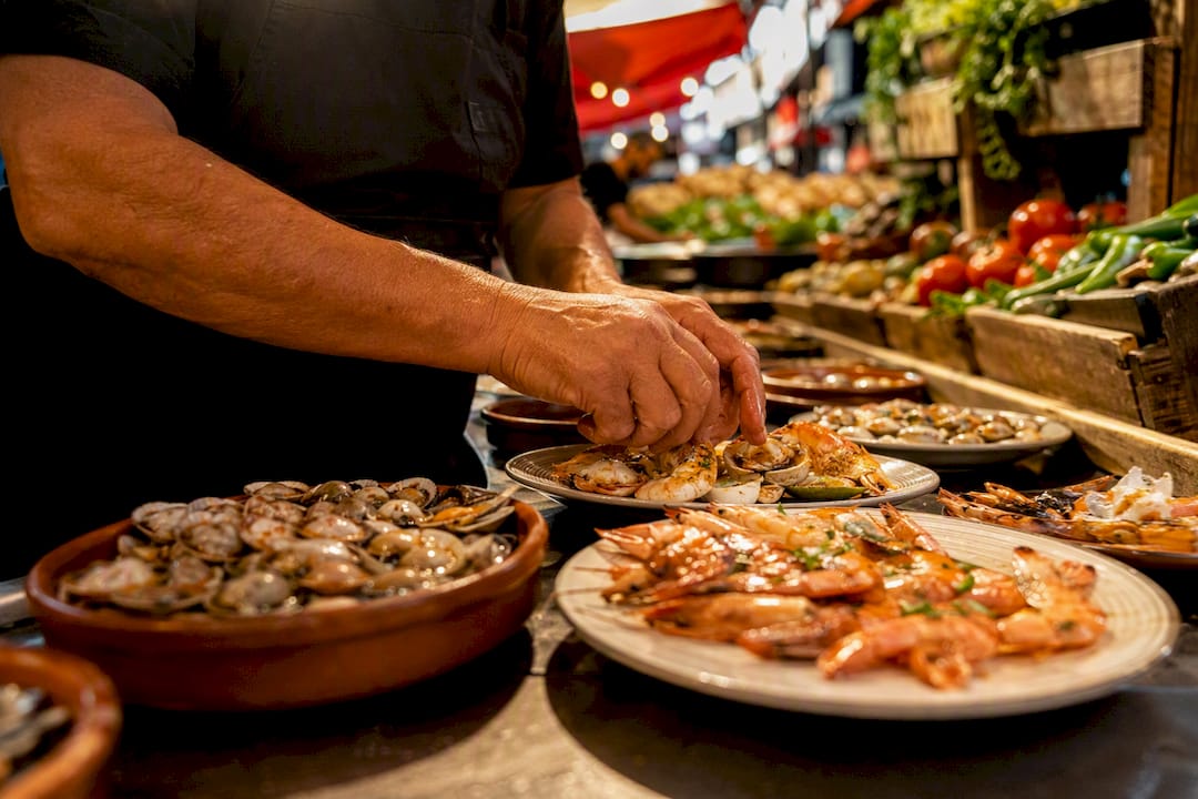 Hands preparing seafood tapas at La Boqueria market