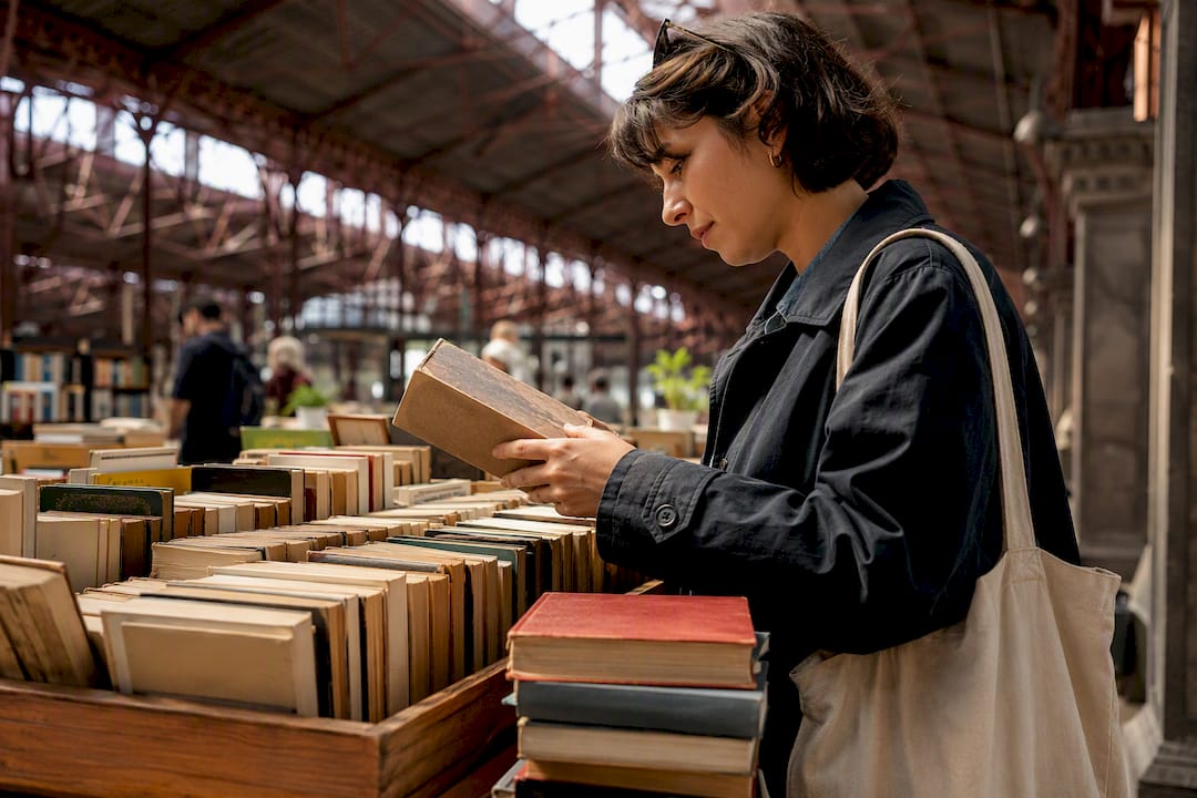 Traveler browsing books at Sant Antoni market