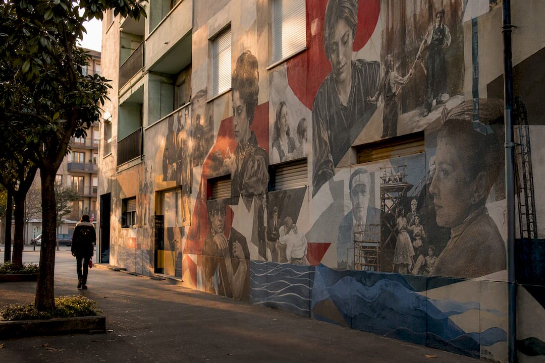 Civic mural across an Ortica building facade
