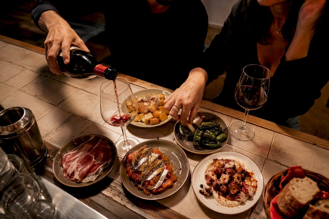 Couple sharing tapas and wine