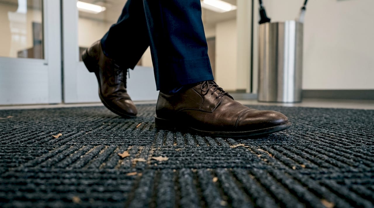 Close-up of shoes on Waterhog mat