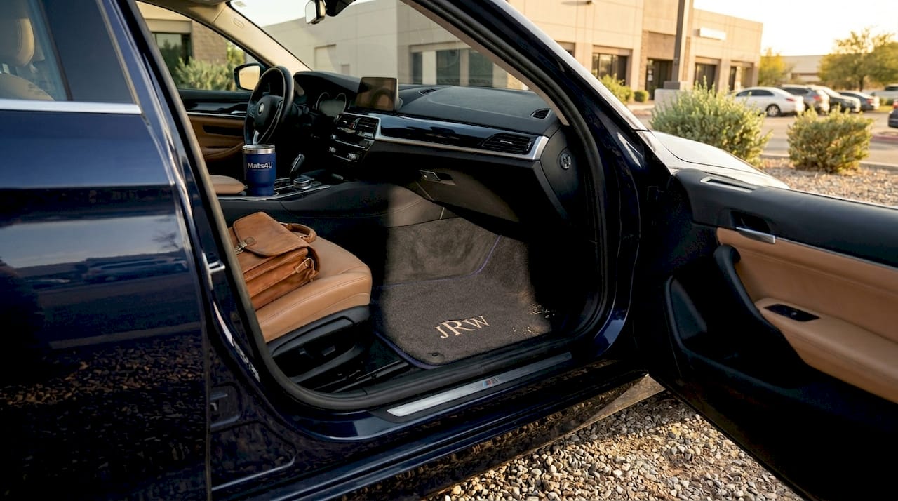 Executive car interior with carpet monogrammed mat