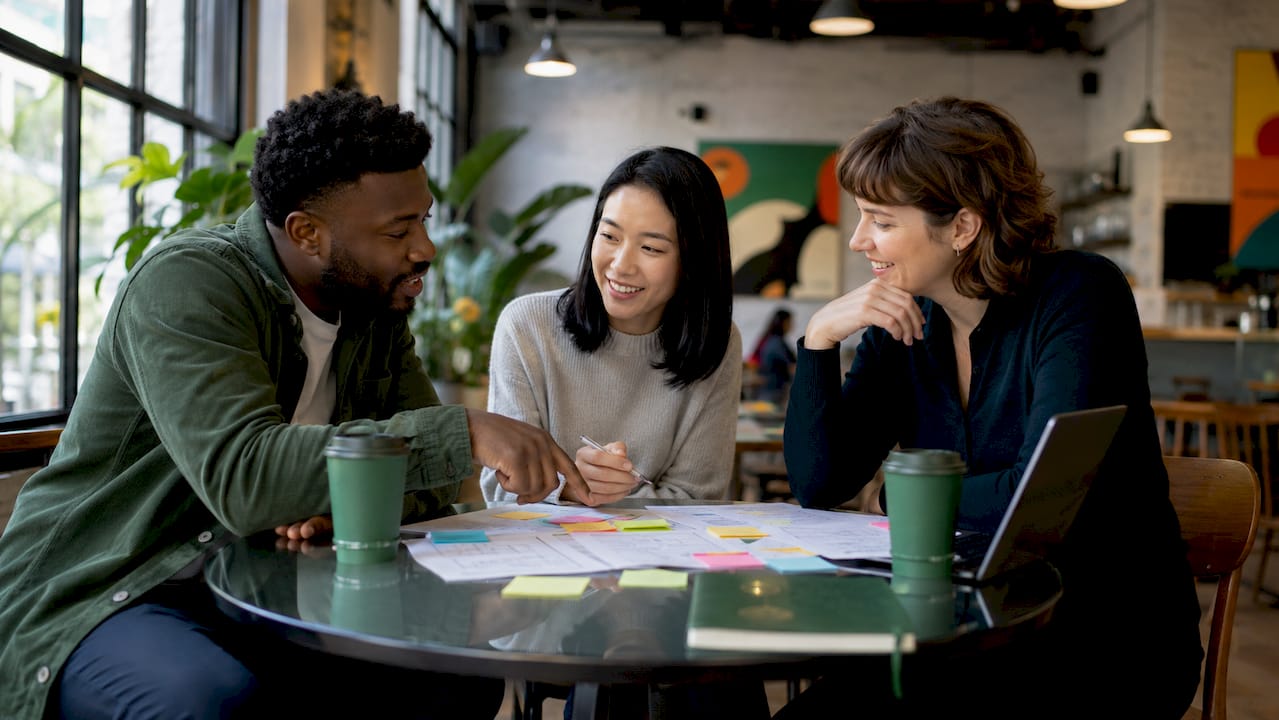 Colleagues planning relocation strategy in meeting room
