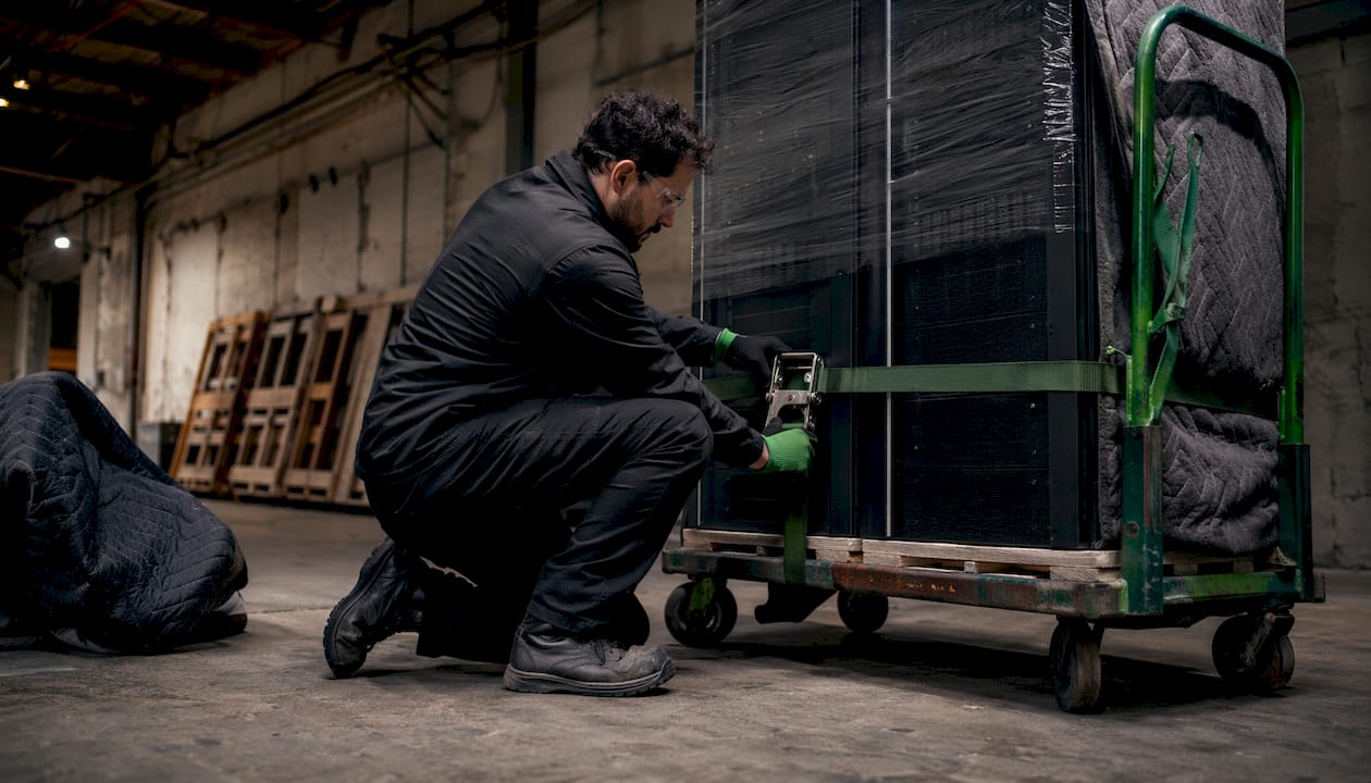 Mover securing office server rack on hydraulic dolly