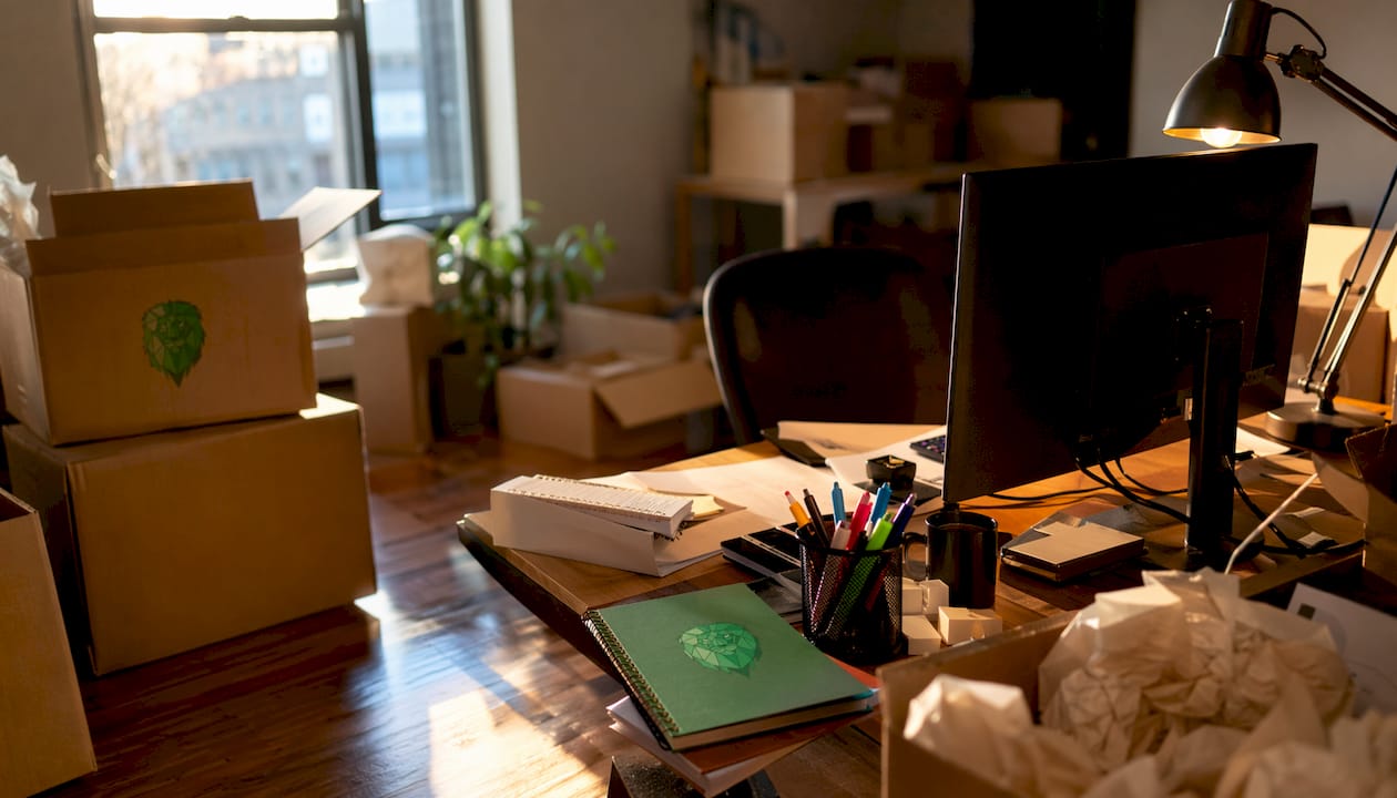 Open office space with moving boxes overhead view
