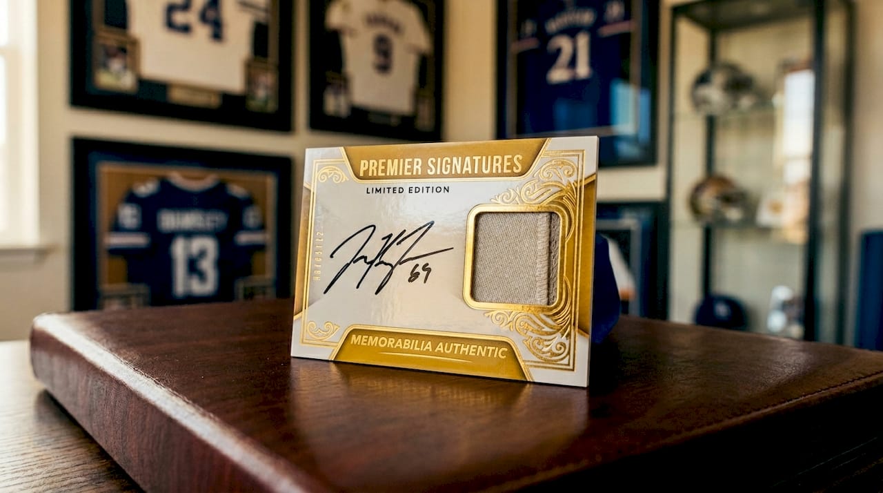 Close-up signed memorabilia card showing autograph and jersey