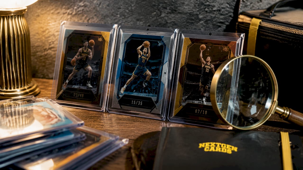 Close-up of serial numbered basketball cards with magnifier